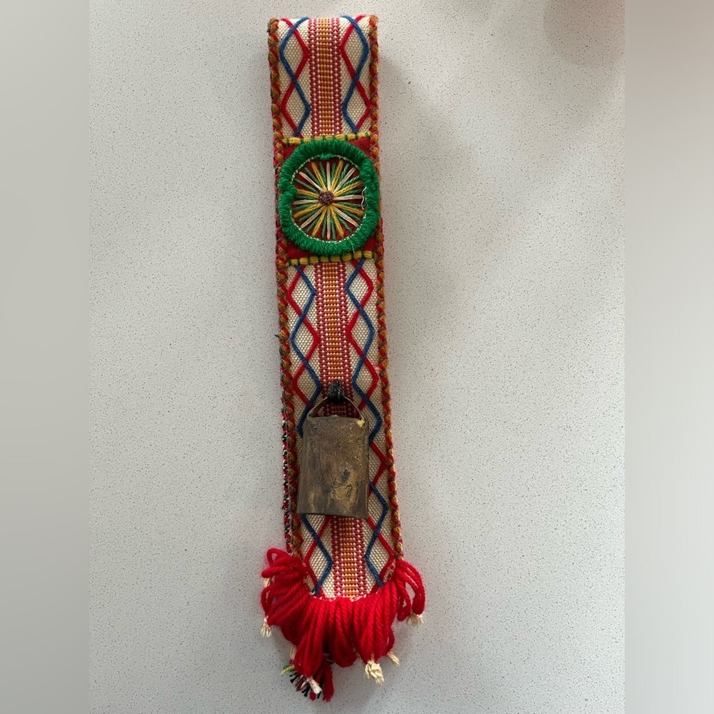Intricate handmade one-of-a-kind herder’s belt with vintage bell, woven colorful